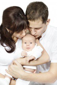 148115241 Parents kissing baby 202x300 Postnatal depression: Renee’s battle with the blues