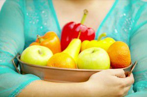 Holding fruit 300x199 Healthy pre pregnancy diet makes healthy babies!