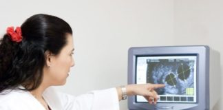 Doctor examining results on a screen