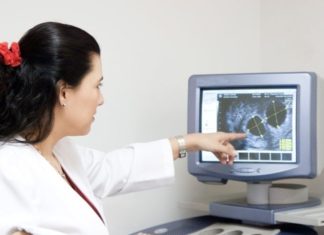 Doctor examining results on a screen