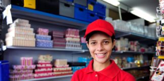 Young woman working in a gift box store.