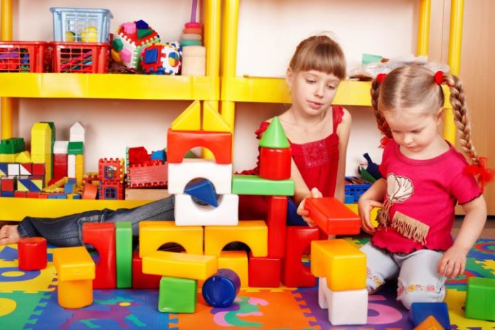 Girls playing with toys