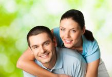 Young happy smiling attractive couple, outdoors.