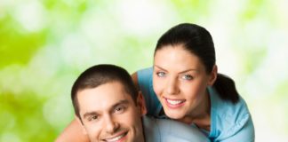 Young happy smiling attractive couple, outdoors.