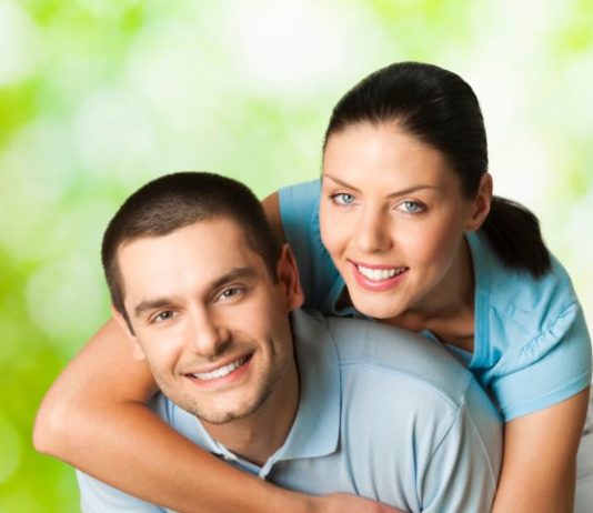 Young happy smiling attractive couple, outdoors.