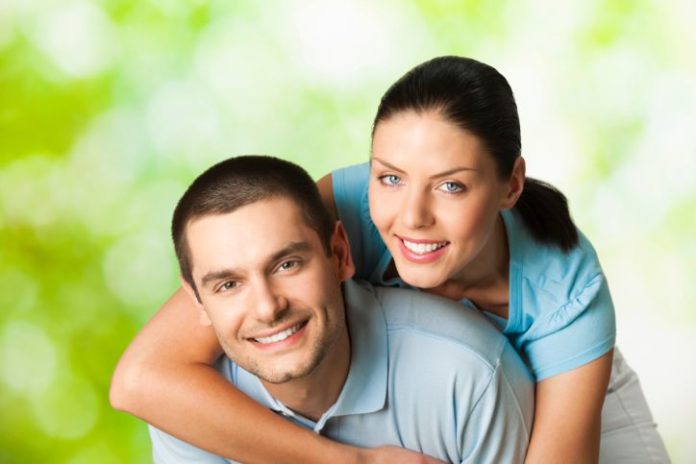 Young happy smiling attractive couple, outdoors.