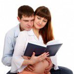 Pregnant couple reading