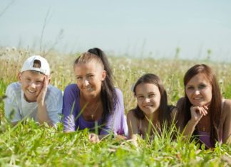 Two happy women with teens.