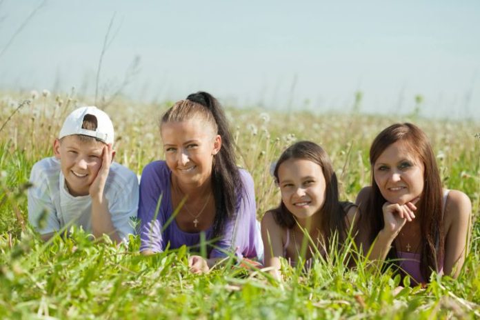 Two happy women with teens.