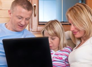 A family uses a laptop.