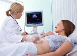 Pregnant woman getting ultrasound