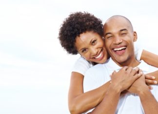 Happy couple isolated on white.