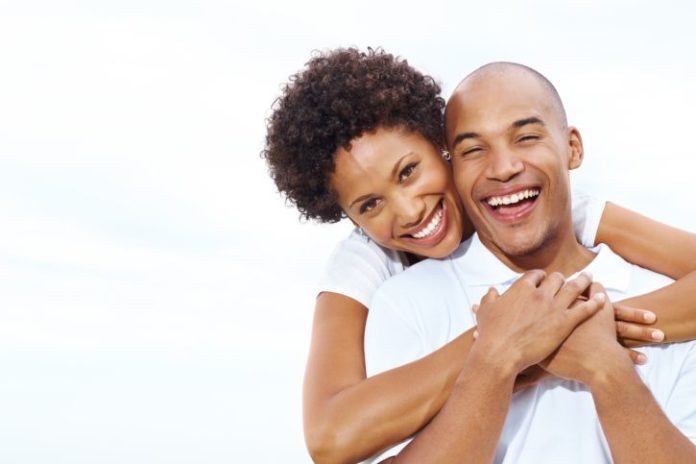 Happy couple isolated on white.