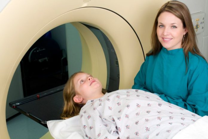 A girl gets an MRI.