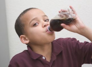 Boy drinking soft drink