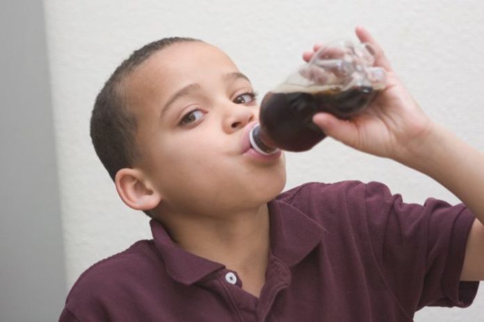 Boy drinking soft drink