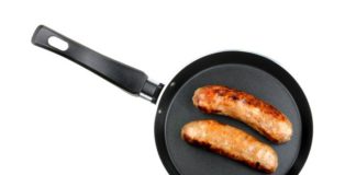 Two sausages in a frying pan.