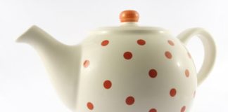 White teapot with orange polka-dots.