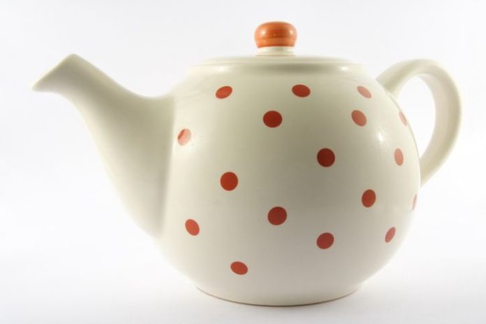 White teapot with orange polka-dots.
