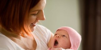 Mother holding newborn baby