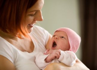 Mother holding newborn baby