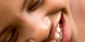 Close up of a girl smiling.
