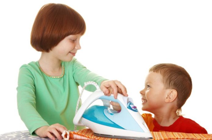 Children ironing.