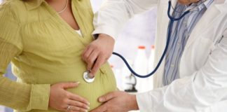 Pregnant woman with doctor