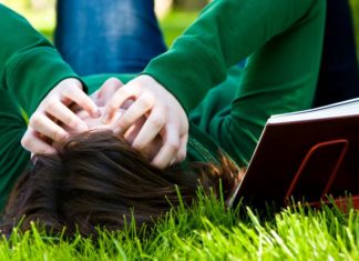 Tired teenager on grass