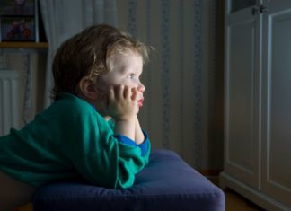 Boy watching tv.