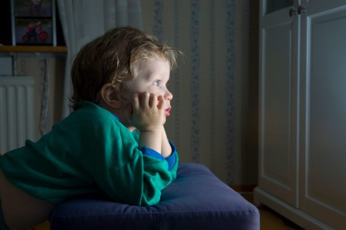 Little boy watching TV.