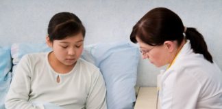 Girl in hospital with doctor