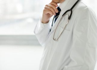 A doctor in white coat.