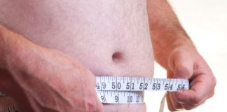 Man measuring stomach.