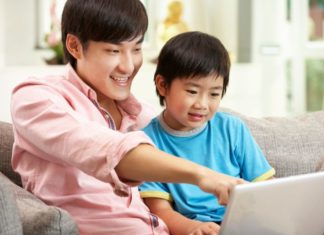 Father and son on computer