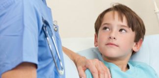 Boy in hospital looks hopeful