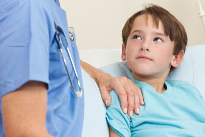 Boy in hospital looks hopeful