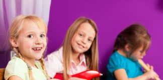 Drums, guitar, recorder and girls playing.