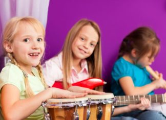 Drums, guitar, recorder and girls playing.