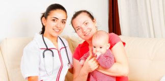 Midwife helping mum at home