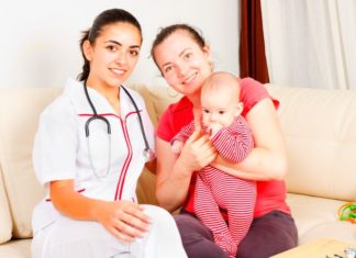 Midwife helping mum at home