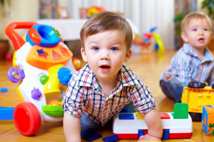 Toddlers playing with toys