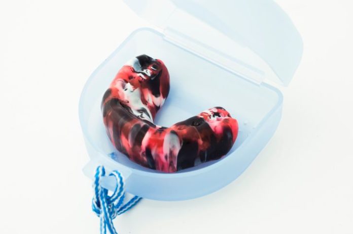 Red, black and white mouth guard
