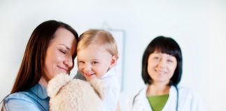 Mother and daughter with doctor