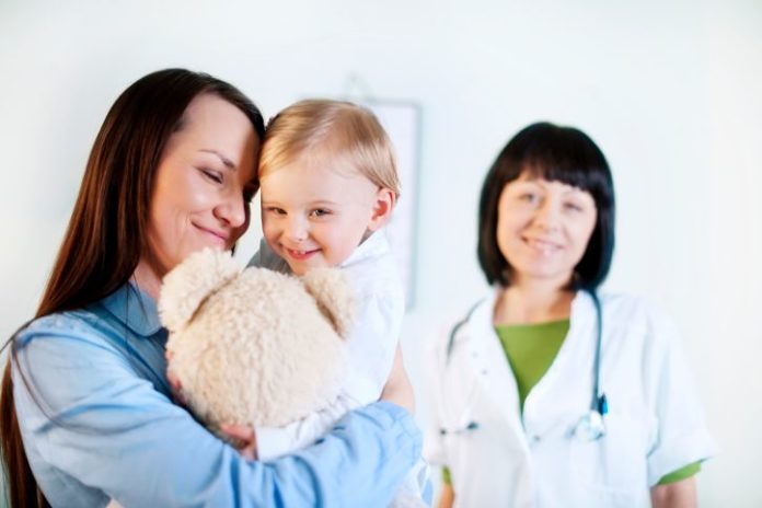 Mother and daughter with doctor