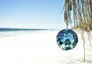 shiny xmas ball at beach