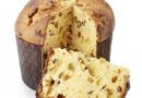 Panettone and slice isolated on white, clipping path included