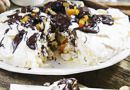 Pavlova with dried apricots, prunes, nuts, chocolate,
