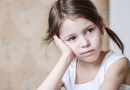 Dissatisfied preschooler girl in the kitchen