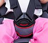 Girl sitting at carseat and fasten seat belt